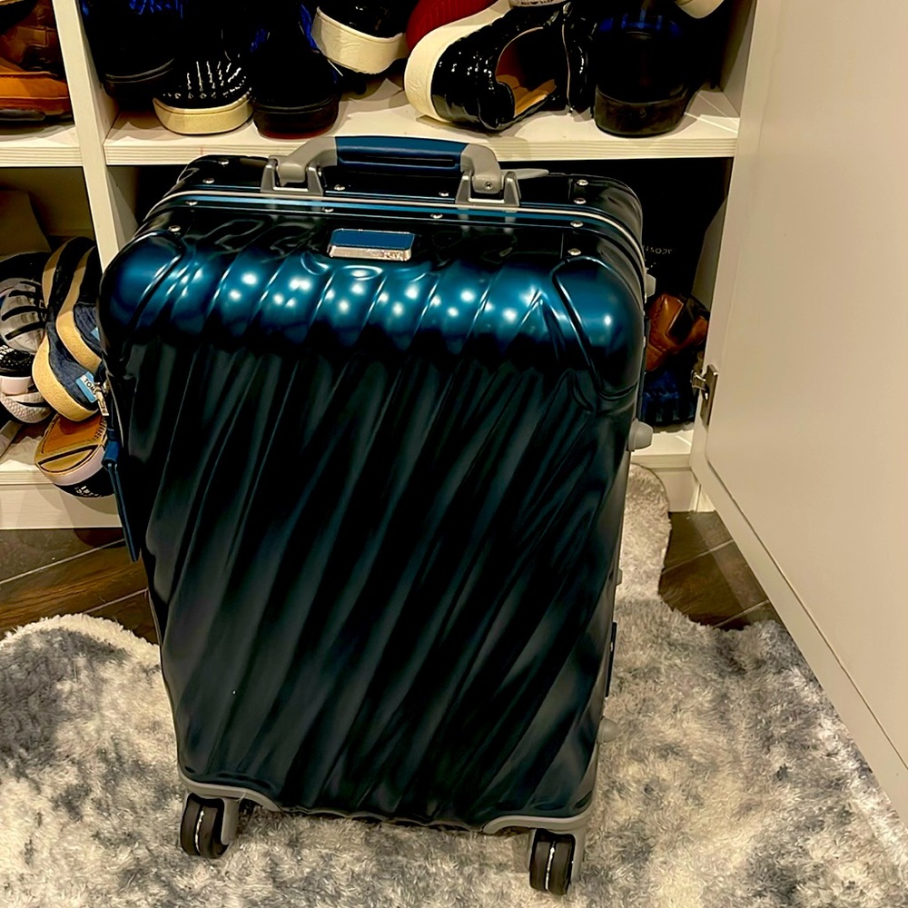 TUMI carry on luggage w TSA locks. Hard side used once.